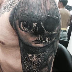 Creepy doll tattoo #SandryRiffard #blackandgrey #realism #realistic #doll #skull