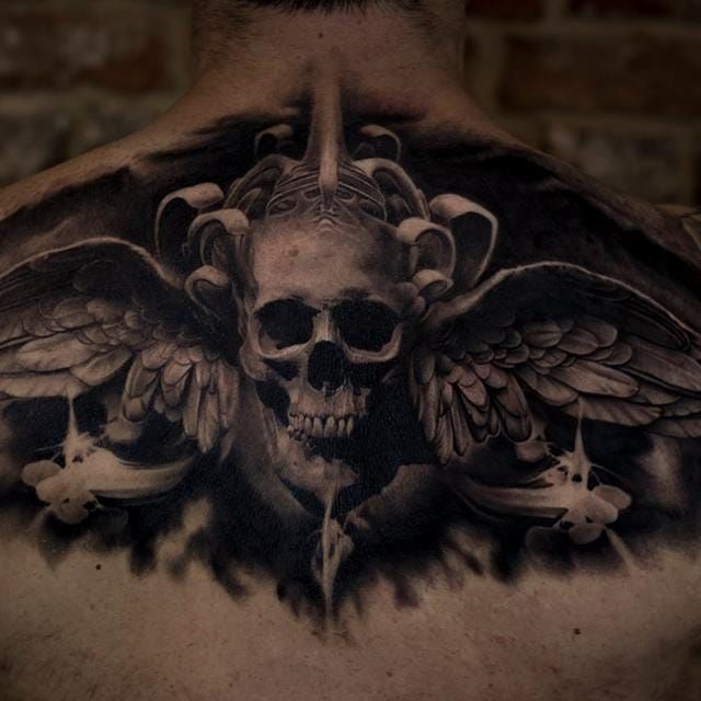 skull wings back tattoo
