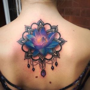 A lovely watercolor lotus adorned with ornamental work and jewels by Jeremy Sloo Hamilton (IG—slootattoos). #JeremySlooHamilton #jewels #lotus #ornamentation #vibrant #watercolor