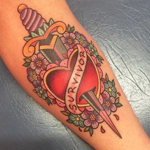 Traditional heart dagger tattoo by Sarah K. #SarahK #girly #traditional #dagger #flower #heart #heartdagger