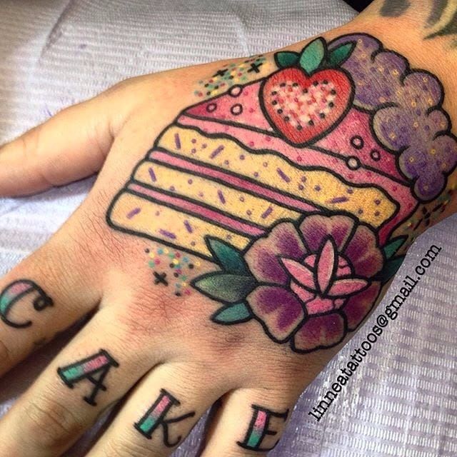 Hand poked strawberry cake tattoo done on the inner