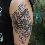 Burning bird tattoo by Or Kantor #OrKantor #birdtattoos #blackwork #bird #linework #feathers #wings #fire #tibetan #folktraditional #burning