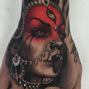 Kali tattoo by Cristian Casas #CristianCasas #portraittattoos #color #blackandgrey #neotraditional #face #eyes #goddesskali #jewelry #nosering #gems #thirdeye #allseeingeye #goddess #deity #tattoooftheday