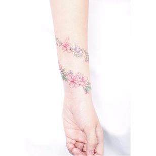 Floral bracelet tattoo by Mini Lau. #MiniLau #lavender #flower #floral #bracelet #band #lovely #subtle #fineline