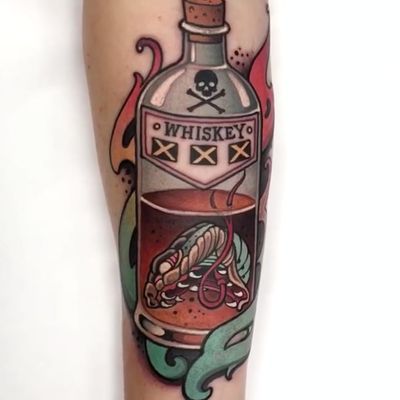 Snake head whiskey tattoo by W.T. Norbert #wtnortbert #drinktattoos #color #neotraditional #snake #snakehead #whiskey #bottle #glass #skull #crossbones #fire #drunk #drink #alcohol