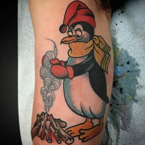 Penguins get cold too. Tattoo by Chad Koeplinger. #traditional #penguin #fire #ChadKoeplinger