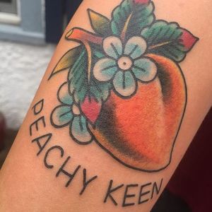 Peachy keen tattoo by Jed Patrick. #fruit #peach #peachykeen #phrase #traditional #JedPatrick