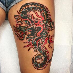 Beautiful dragon on the thigh tattoo done by Jason Ochoa. #JasonOchoa #GreenPointTattooCo #traditionaltattoo #boldtattoos #dragon #classic