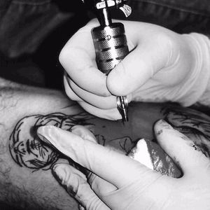 Giving a customer a tattoo. #Tattooing #TattooArtist