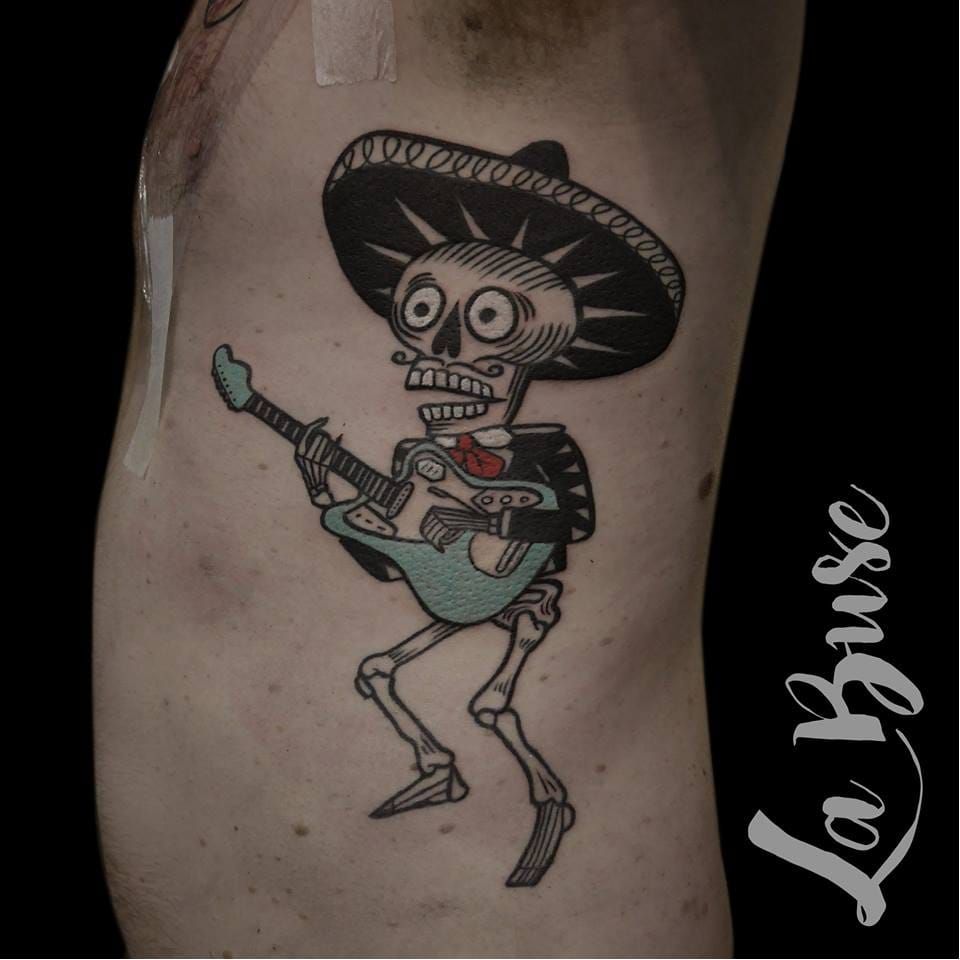 skeleton playing guitar  my brother drew tattoo
