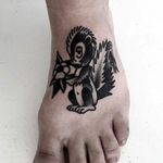 Awesome looking skunk on foot! Tattoo by Levi Rivoire. #levirivoire #traditional #blacktattoos #skunk #skunktattoo