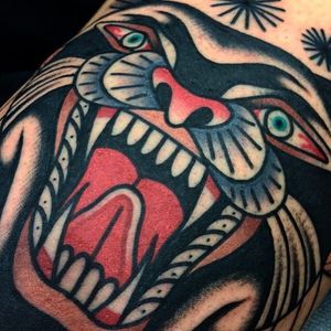 Close up shot of a tattoo done by Giacomo Fiammenghi. Super solid and clean! #GiacomoFiammenghi #traditionaltattoo #brightandbold #panther #coloredtattoo