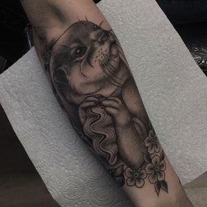 Smooth black and grey otter tattoo by Gem Carter. #neotraditional #flowers #blackandgrey #otter #GemCarter