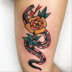 Snake and flower tattoo by Jason Ochoa #JasonOchoa #snaketattoos #color #traditional #flower #floral #snake #reptile #animal #nature