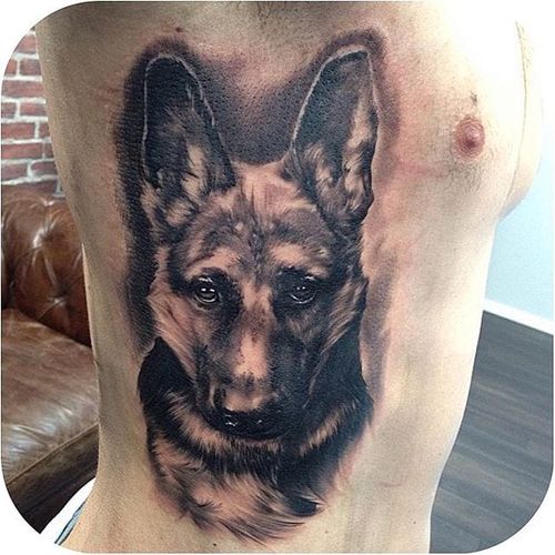 Black and grey German Shepherd puppy tattoo by Christopher Henriksen. #dog #germanshepherd #realism #blackandgrey #ChristopherHenriksen