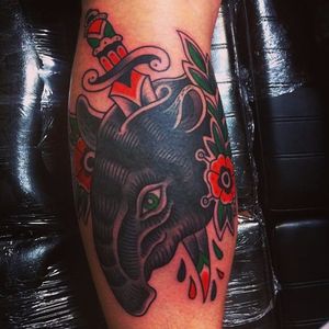Traditional tapir and dagger tattoo by Joris Mous. #traditional #dagger #tapir #flower #JorisMous