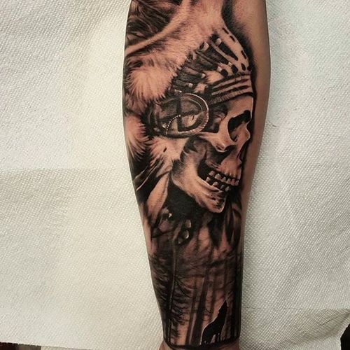 Skull chieftain with an incredible scenic work below. Amazing tattoo by Nathan Hebert. #nathanhebert #blackandgrey #skull #realism