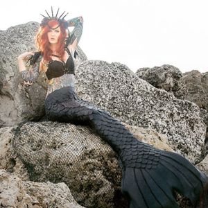 A photo of tattoo model Luna Marie Lom dressed as a mermaid. #LunaMarieLom #mermaid #traditional