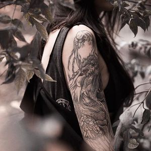 The girl with the dragon tattoo. Pictured, Lesya Kovalchuk. Dragon tattoo by Sasha Mashiuk. (Photo by Dmitriy Mel.) #LesyaKovalchuk #blackwork #mythology #dragon #SashaMashiuk