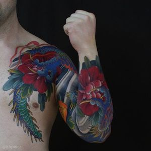 A stunning dragon sleeve with peonies by Artemy Neumoin (IG—ishpiricatattoo). #ArtemyNeumoin #dragon #Japanese #peonies #sleeve #traditional