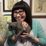 Zoe Bean holds a cute kitten looking for a home. Photo credit Ann Marie Amick (IG -- am_amick) cropped by Tattodo staff #zoebean #eightofswords