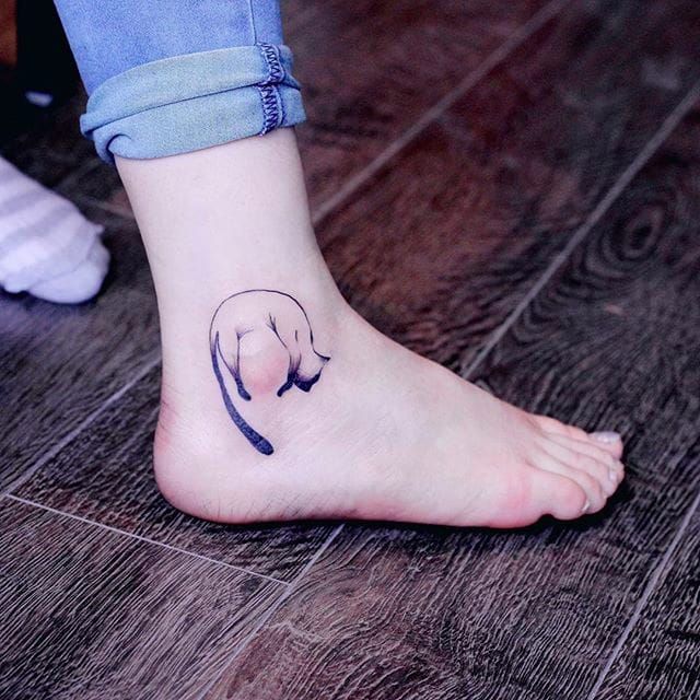 Dog tattoo on the ankle