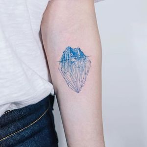 Iceberg tattoo by Sol. #Sol #southkorean #iceberg #ice #mountain #arctic #fineline #beautiful #subtle