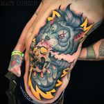 Huge lion tattoo chewing on a smoking skull. #mattcurzon #lion #skull #neotraditional