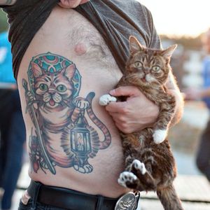 A photograph Lil Bub and his tattooed buddy by Leslie Plesser. #cattoos #strange #unusual #weird