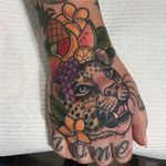 Leopard and fruit hand tattoo by Clare Clarity. #handtattoo #fruit #flower #bigcat #leopard #ClareClarity