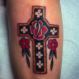 Beautiful classic tattoo image, a cross with some blossoms. Rad tattoo by Jacob N. #JacobN #traditionaltattoo #boldtattoo #oldschool  #cross #blossoms #traditional