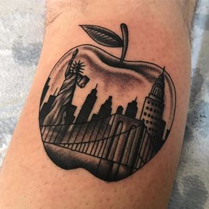 The Big Apple by Paulo Benevides #PauloBenevides #NYC #NewYork #bigapple #apple #nycskyline #buildings #empirestatebuilding #bridge #statueofliberty #blackandgrey #blackwork #traditional #tattoooftheday