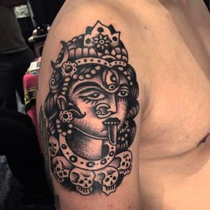 Solid black work tattoo of Kali, the God of death and destruction. Solid work by Robert Ryan. #RobertRyan #esoteric #boldtattoos #traditionaltattoos #kali #blacktattoo