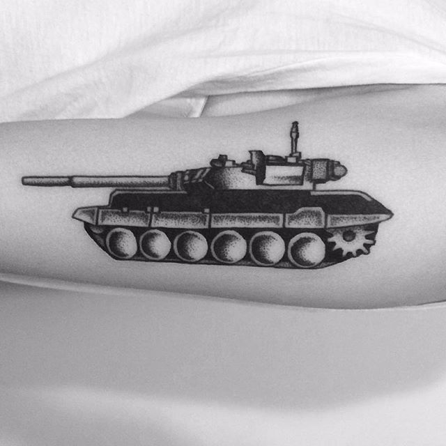 Small fine line style tank tattoo on the inner wrist
