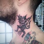 Clean and solid little demon neck tattoo done by Simon Erl. #SimonErl #blackwork #traditionaltattoos #blacktattoos #DHARMAtattoo #demon #devil #necktattoo