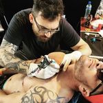 Luca Testadiferro working on a neck tattoo #LucaTestadiferro #tattooartist #necktattoo