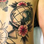 Awesome looking globe tattoo with some blossoms. Tattoo work by Wilson Ng. #WilsonNg #BoldTattoos #traditionaltattoo #globe #blossoms #traditional #traditionalglobe