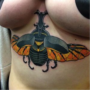 Beetle tattoo by Robert Oldfield, photo from Instagram @racotattoo #RobertOldfield #neotraditional #neon #beetle #underboob