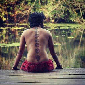 Yogi with some sweet chakra tattoos, artist unknown. #Spine #Yogi #Chakras