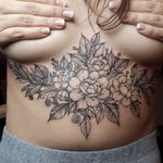 Delicate floral tattoo by Sergey Anuchin #SergeyAnuchin #linework #flower #sternum #flowers #floral #blackwork
