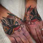 Hand tattoos by Chris Stuart #ChrisStuart #birdtattoos #color #traditional #handtattoo #bird #feather #wings #banner #text #quote #flowers #floral #swallow