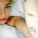 Planet and cat tattoos by Lauren Winzer. #MileyCyrus #LaurenWinzer #planet #cat