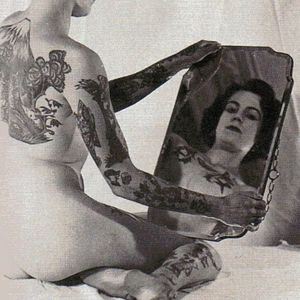 Pam Nash gazing into a mirror. #BristolTattooClub #England #LesSkuse #PamNash #tattoohistory #tattoopioneer