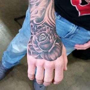 Black and grey rose hand tattoo by dotyink. #blackandgrey #realism #dotyink #flower #rose