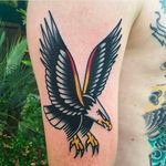 Beautifully done classic bald eagle tattoo by Joshua Marks. #JoshuaMarks #ETS #traditionaltattoos #boldtattoos #classic #eagle #baldeagle