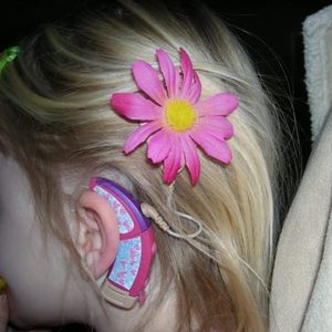 Photo of a girl with cochlear implant, via Pinterest. #cochlearimplant