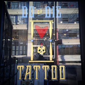 The front door of Do or Die Tattoo, painted by Tina Fino (IG—tina_fino). #DoorDieTattoo #hourglass #signpainting #tattooinspired #skull #TinaFino