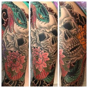 Great combination of soft floral peonies with a harder edge of the skull and snake. Tattoo by Chris O'Donnell. #ChrisODonnell #TraditionalJapanese #KingsAvenueTattoo #NewYorkTattooer #oriental #easternculture #snake #asianart #skull #peoni