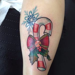 Christmas-themed candy cane tattoo by Frl Zucker. #neotraditional #christmas #candycande #snowflake #holly #FrlZucker