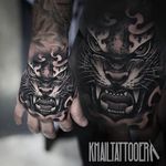 Ferocious black and grey tiger hand tattoo. By Khail Aitken. #realism #KhailAitken #blackandgrey #animal #tiger